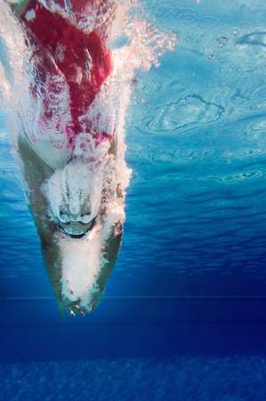 Diving into the water, underwater viewの写真素材