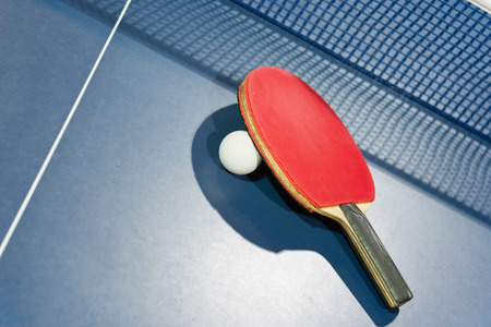 ball and racket on tableの写真素材