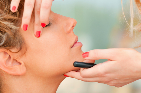 Make-up artist working on a modelの写真素材