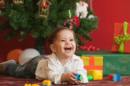 Happy baby boy with Christmas presents. Selective focusの写真素材