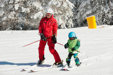 Little boy learning how to skiの写真素材