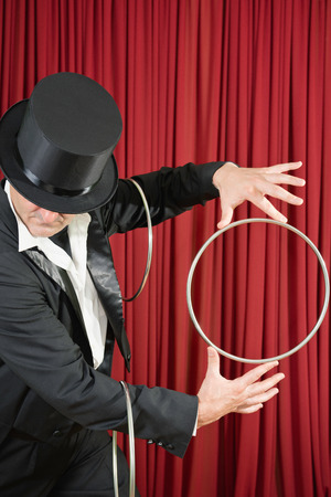 Magician performing trick with magic ringsの写真素材