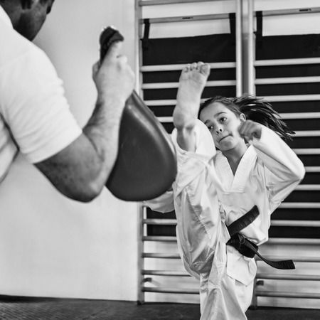 Girl on Tae kwon do training with trainerの写真素材