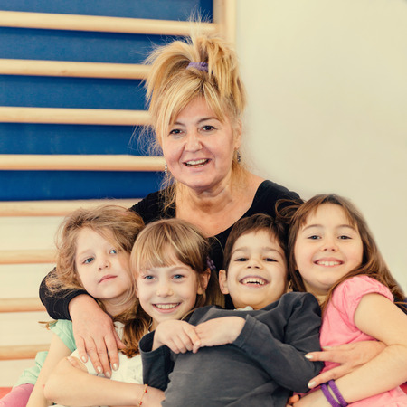 Group portarit with children and physical education teacher. toned image