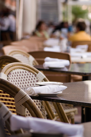 Basic setting in an sidewalk cafe. Selective focus set on a napkin.の写真素材
