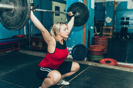 Female on weightlifting trainingの写真素材