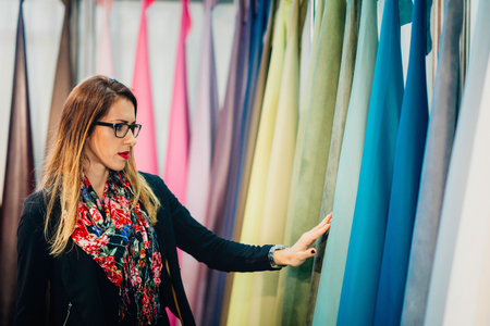 Designer choosing leather for furnitureの写真素材