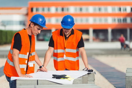 Construction workers on meeting on construction siteの写真素材