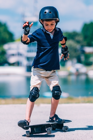 Little boy having fun with snakeboard
