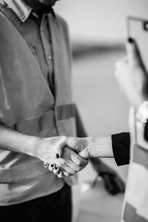 Architects handhaking after successful meeting on construction siteの写真素材