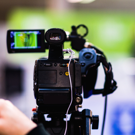 Video camera recording press conferenceの写真素材