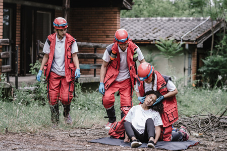 Rescue workers at the disaster scene, saving peopleの写真素材