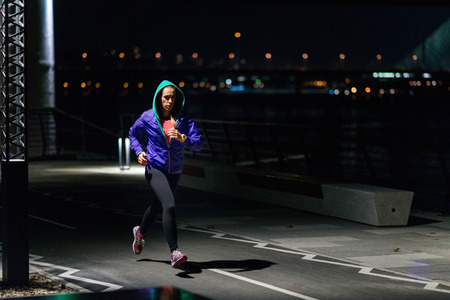 Female late-night jogging outdoors