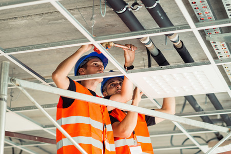 Installation workers working on construction site