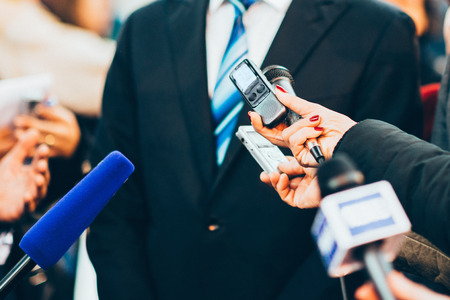 journalist interviewing businessmanの写真素材