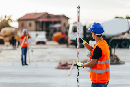 Surveyors on construction siteの写真素材