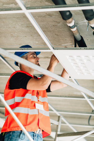 Installation worker on construction site workingの写真素材