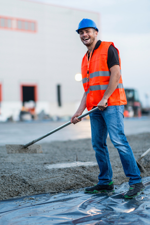 Manual worker leveling concreteの写真素材
