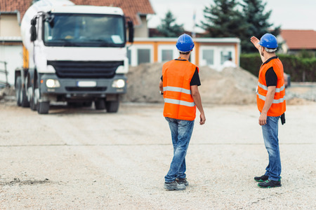 Construction workers navigating truckの写真素材