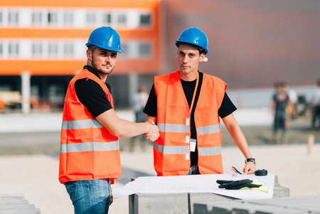 Handshaking on construction siteの写真素材