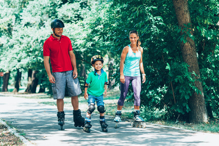 Family roller skating on weekendの写真素材