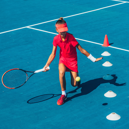 Girl on tennis trainingの写真素材