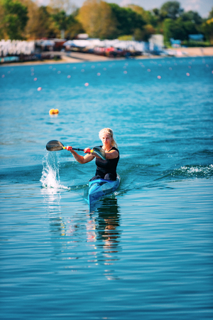 Female athlete in kayakの写真素材