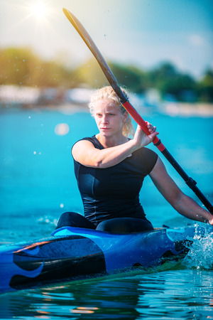 Female athlete in kayakの写真素材