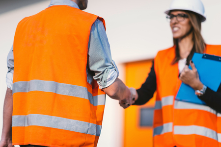 Business handshake on construction siteの写真素材