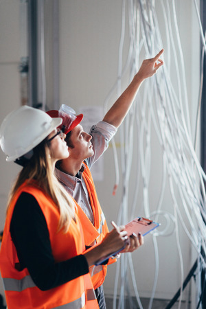 Maintenance Engineers checking cables