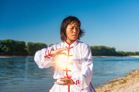Tai Chi on lakeの写真素材