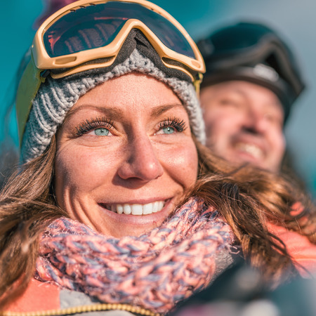 Couple enjoying the winter day on mountain.  の写真素材
