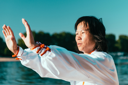 Tai Chi on lakeの写真素材