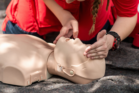 Cpr training outdoors. Reanimation procedure on CPR dollの写真素材
