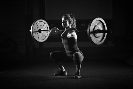 Woman weightlifting on trainingの写真素材