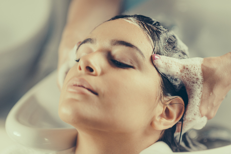 Washing hair in hair salonの写真素材