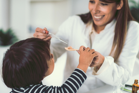 Homeopathy. Little boy and homeopathの写真素材