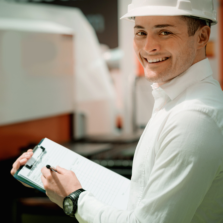 Technology Engineer Working in Factory. Holding check-list and supervisingの写真素材