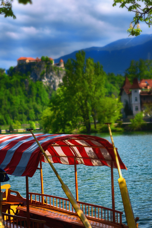 Typical wooden boats, in slovenian call "Pletna", in the Lake Bled, the most famous lake in Slovenia (Europe - Slovenia)の写真素材