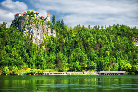 Bled Castle built on top of a cliff overlooking lake Bled, located in Bled, Sloveniaの写真素材