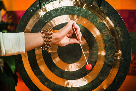 Therapist using Gong in sound therapyの写真素材
