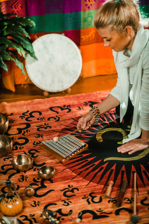 Therapist using Chakra Chimes in sound therapyの写真素材
