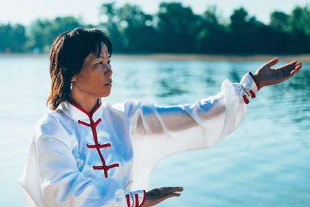 Tai Chi by the lakeの写真素材
