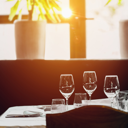 Luxury table setting near window, luxury event conceptの写真素材