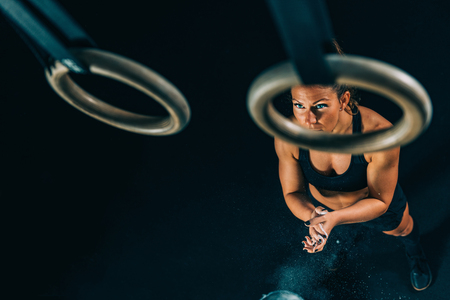 Cross training. Gymnastic rings exercisingの写真素材