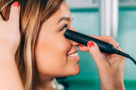 Ophthalmologist examining patient with ocular ultrasound (B-Scan)の写真素材