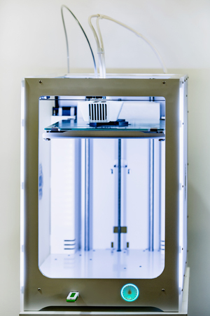 Extended modern white 3D printer close up