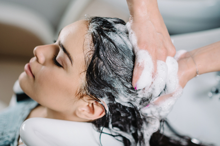 Washing hair in hair salonの写真素材