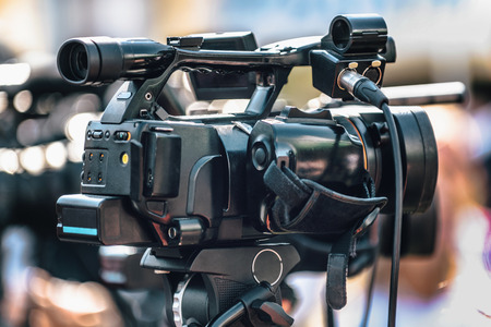 Press conference event. Digital camera recording media event outdoors. Live streaming concept.の写真素材