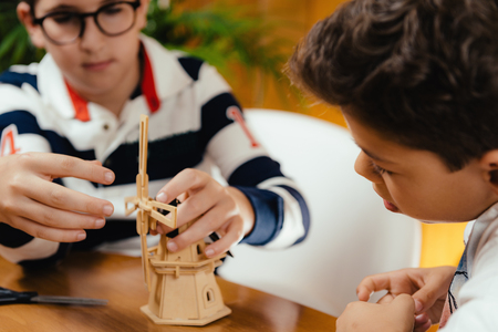 Creative boys playing with generic unbranded toy.の写真素材